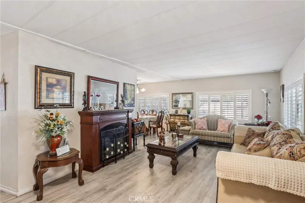 3700 Buchanan Street, Unit 28 Riverside, CA 92503 - Photo 4 of 35 a living room with furniture and a fireplace