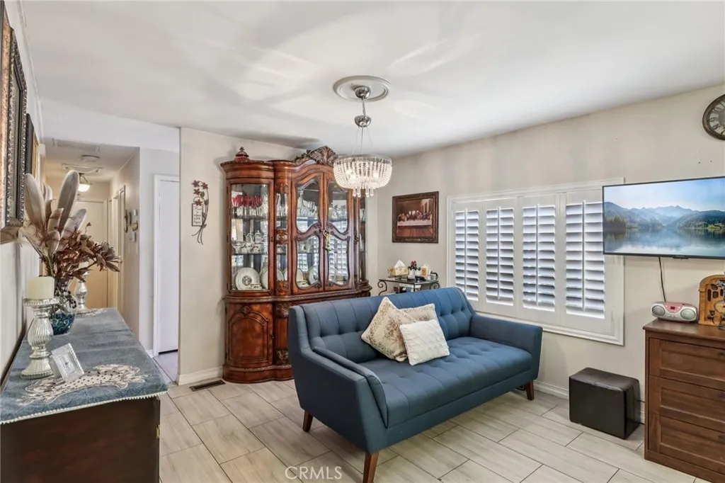 3700 Buchanan Street, Unit 28 Riverside, CA 92503 - Photo 10 of 35 a living room with furniture and a large window