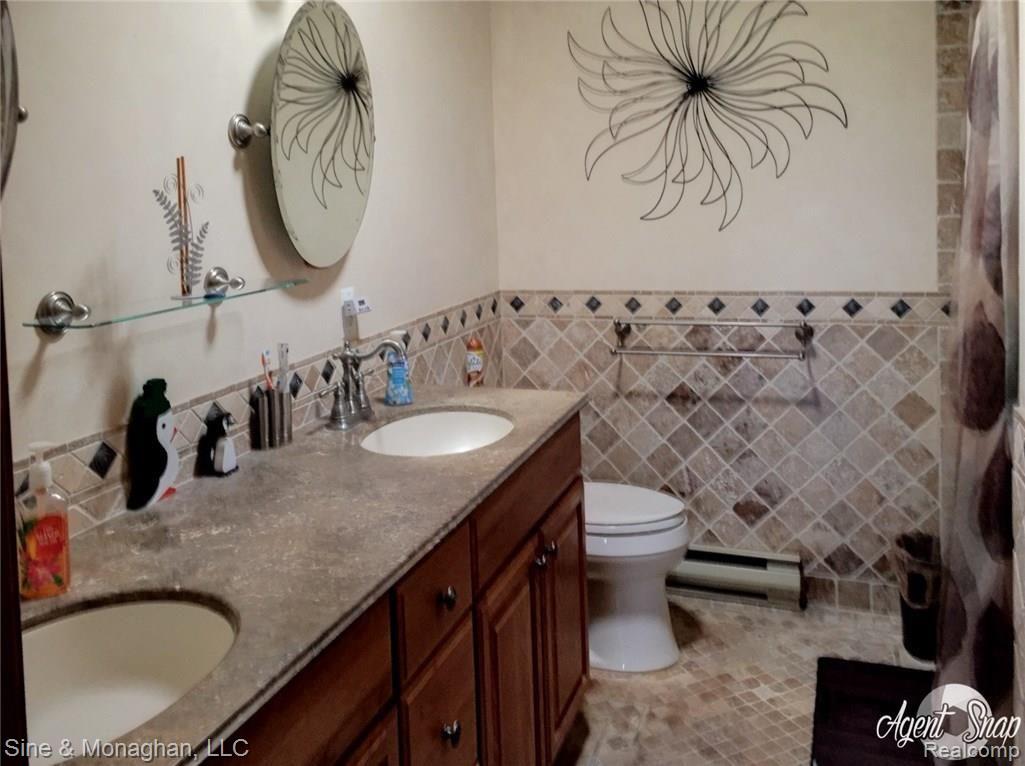 10479 Carroll Road Columbus, MI 48063 - Photo 31 of 52 Main bath with one piece counters and radiant heat floors