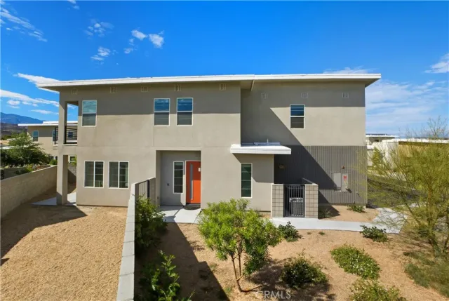a front view of a house with yard