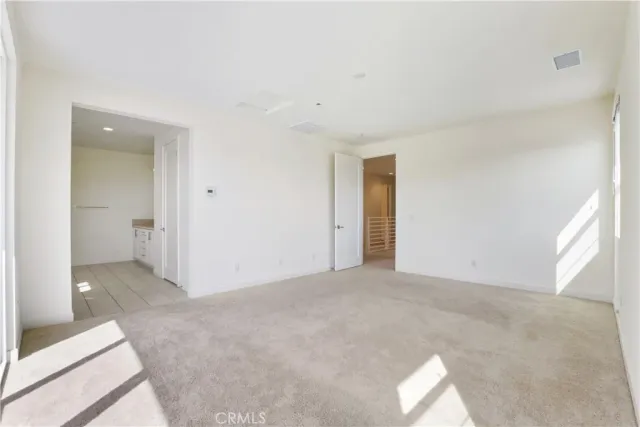 a view of a balcony with two chairs and a table