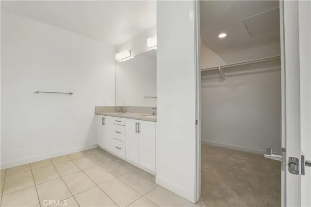 a bathroom with a shower and a glass door