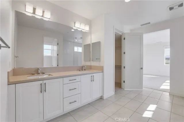 a white toilet sitting next to a shower