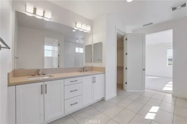 a white toilet sitting next to a shower