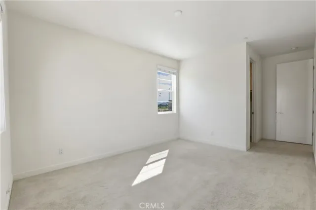 an empty room with a empty space and window