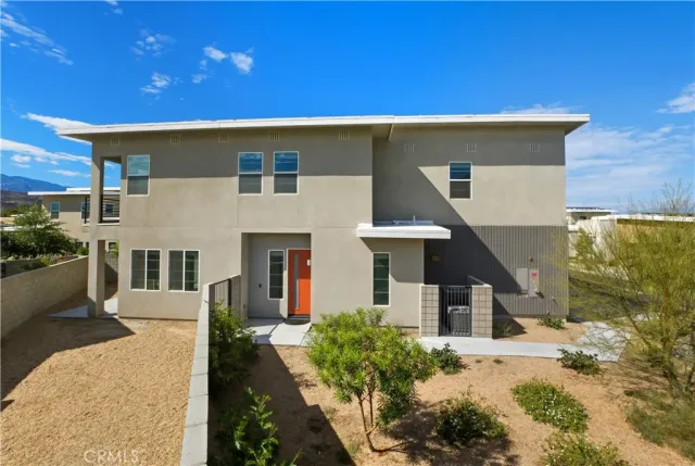a front view of a house with yard