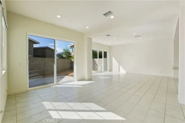 a view of a hallway with wooden floor and entryway