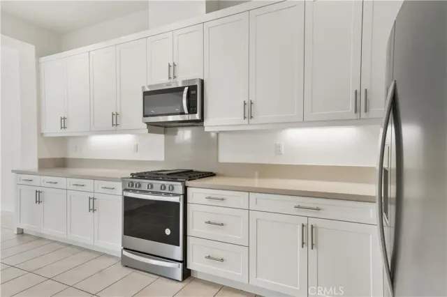 a view of a kitchen with a sink and a window