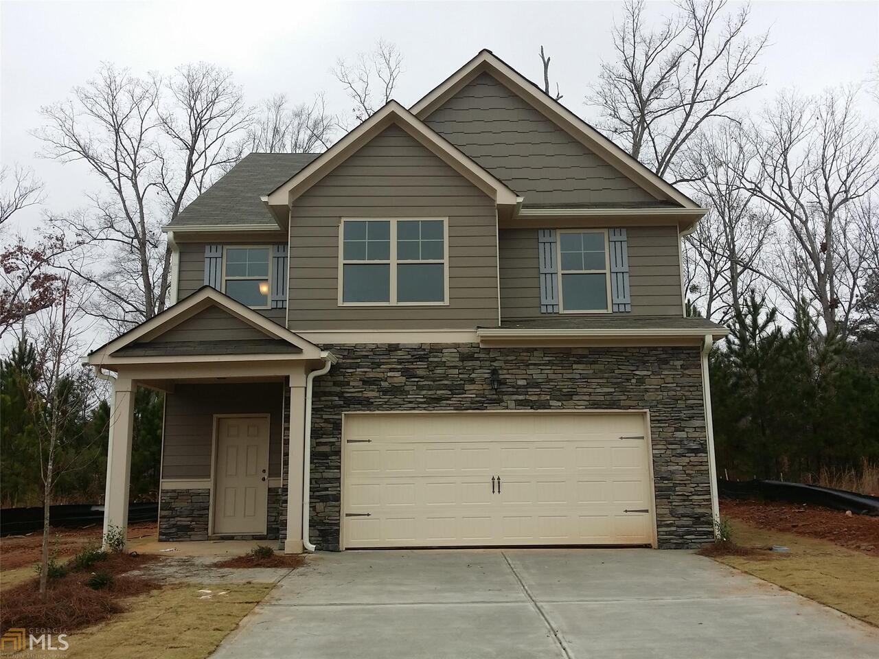 4888 Longview Run, Unit 20 Decatur, GA 30035 - Photo 1 of 1 a front view of a house with a yard and garage