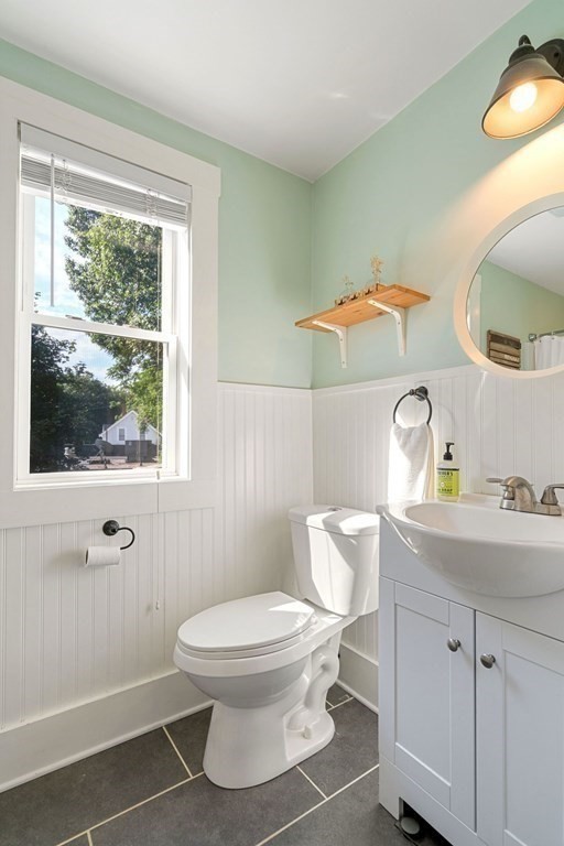 11 Hadwin Way Boston, MA 02131 - Photo 12 of 22 a white toilet sitting next to a bathroom sink