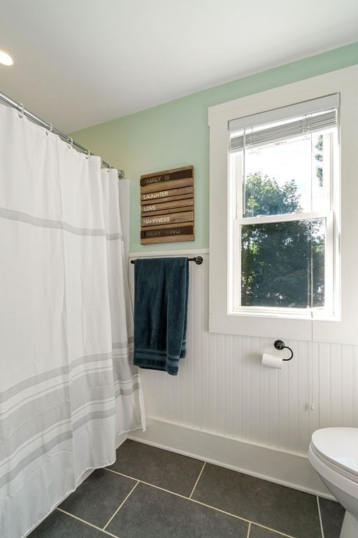 11 Hadwin Way Boston, MA 02131 - Photo 13 of 22 a bathroom with a toilet a sink and shower