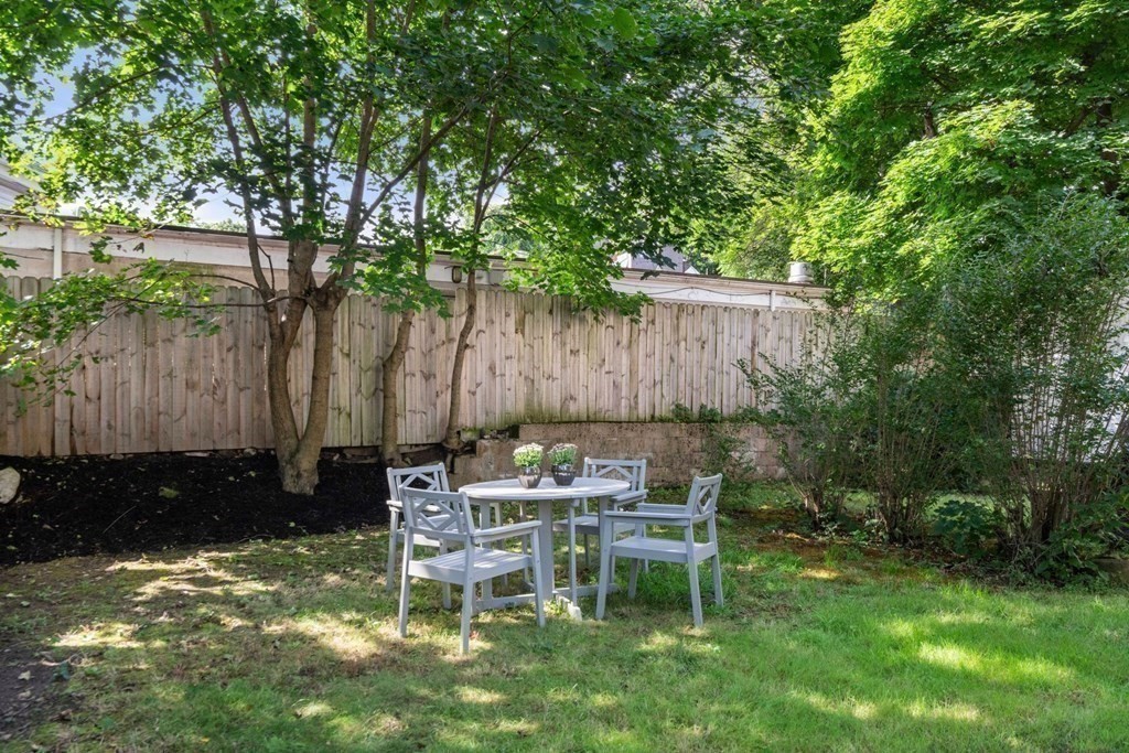 11 Hadwin Way Boston, MA 02131 - Photo 20 of 22 a backyard of a house with table and chairs