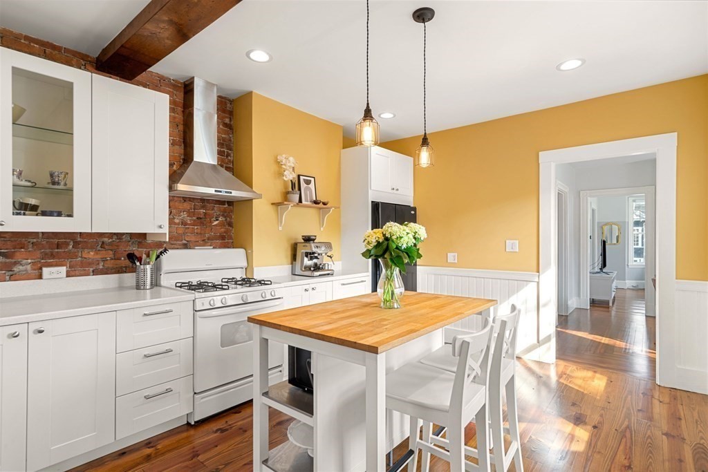 11 Hadwin Way Boston, MA 02131 - Photo 3 of 22 a kitchen with a table and chairs in it