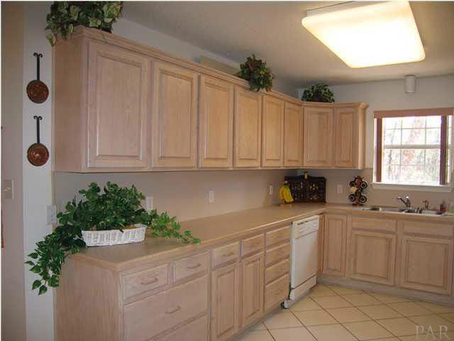 2600 Crescent Road Navarre, FL 32566 - Photo 6 of 24 Ktichen. Oak Cabinets with a lot of pull outs.