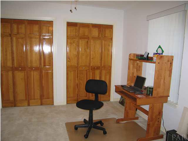 2600 Crescent Road Navarre, FL 32566 - Photo 8 of 24 Additional Bedroom, being used as an office. This room has pocket doors to the great room.
