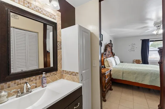 a bedroom with a bed and a sink