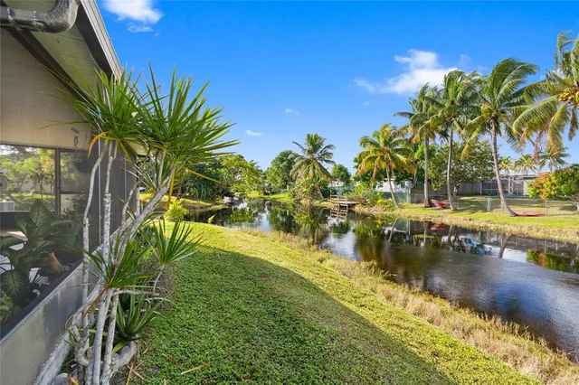 a view of a lake with a yard