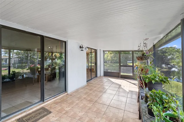 a spacious bedroom with a large window and bed