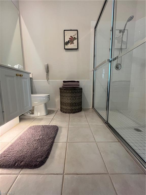 5477 Freeport Lane Naples, FL 34119 - Photo 16 of 36 a bathroom with a sink and a mirror