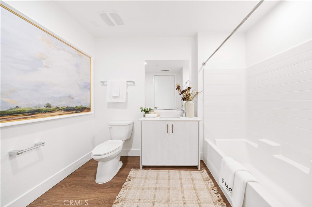 709 East Walnut Street, Unit 222 Pasadena, CA 91101 - Photo 12 of 46 a bathroom with a sink a toilet and bathtub