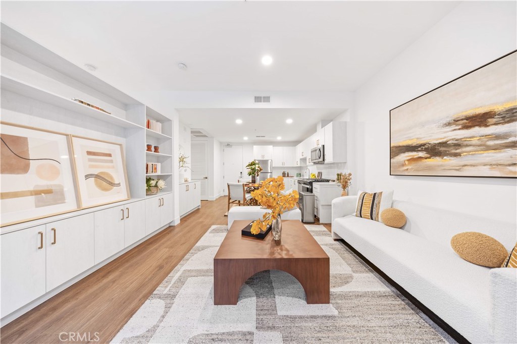 709 East Walnut Street, Unit 222 Pasadena, CA 91101 - Photo 2 of 46 a living room with furniture and wooden floor
