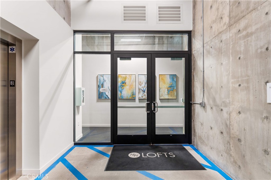 709 East Walnut Street, Unit 222 Pasadena, CA 91101 - Photo 26 of 46 a view of front door with a glass door