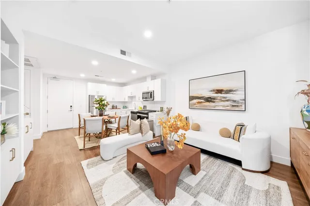 a living room with furniture and a table