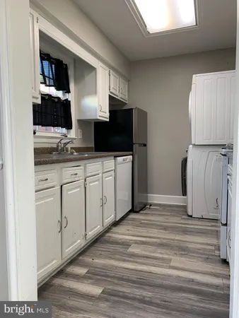a spacious bathroom with a double vanity sink and a mirror
