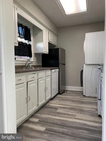 a spacious bathroom with a double vanity sink and a mirror