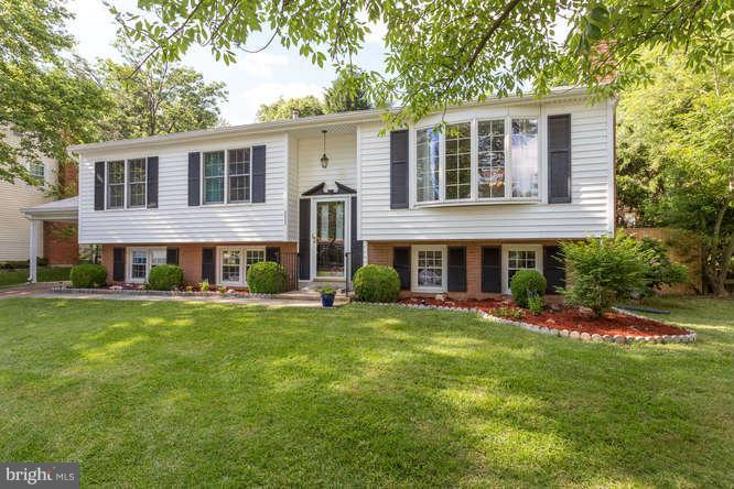 9522 Kirkfield Road Burke, VA 22015 - Photo 1 of 23 a front view of a house with a garden