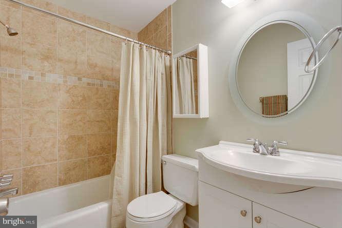 9522 Kirkfield Road Burke, VA 22015 - Photo 12 of 23 a bathroom with a sink a toilet and shower