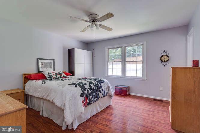 9522 Kirkfield Road Burke, VA 22015 - Photo 13 of 23 a bedroom with a bed and window