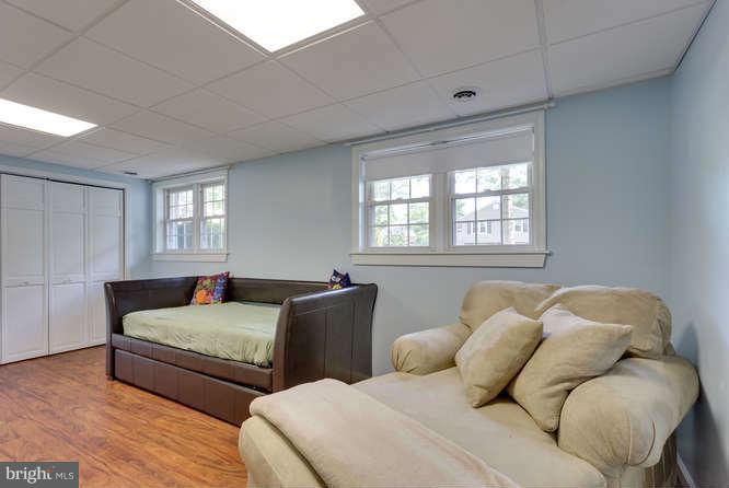 9522 Kirkfield Road Burke, VA 22015 - Photo 20 of 23 a bedroom with two beds and a window