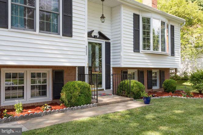 9522 Kirkfield Road Burke, VA 22015 - Photo 3 of 23 a front view of a house with a yard and garage