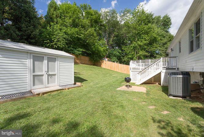 9522 Kirkfield Road Burke, VA 22015 - Photo 21 of 23 a backyard of a house with lots of green space