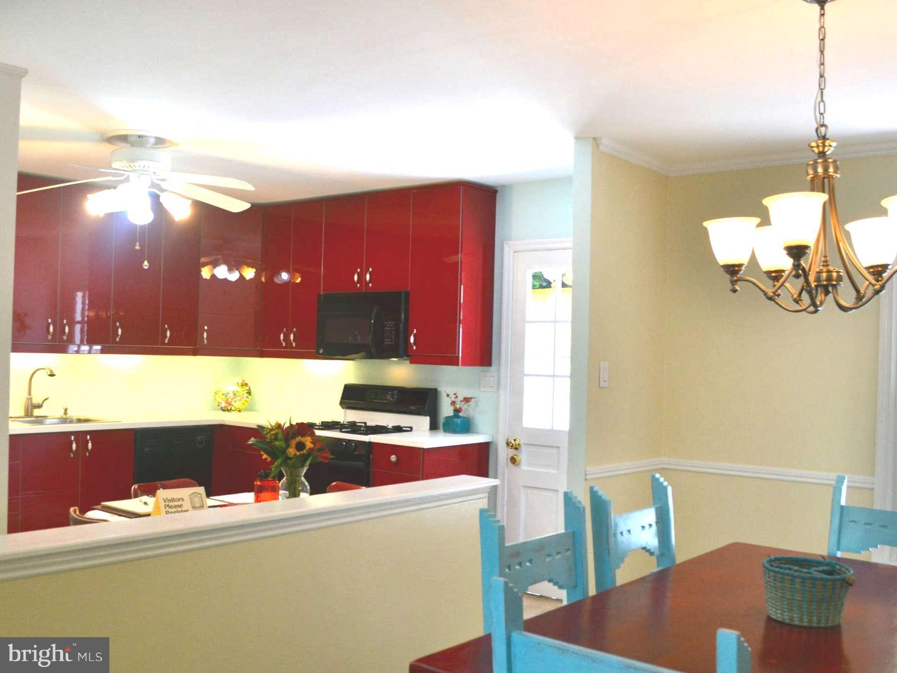 9522 Kirkfield Road Burke, VA 22015 - Photo 7 of 23 a kitchen with a table and chairs