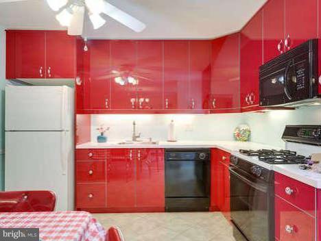 9522 Kirkfield Road Burke, VA 22015 - Photo 8 of 23 a kitchen with a stove a sink and a microwave