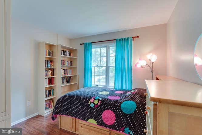9522 Kirkfield Road Burke, VA 22015 - Photo 10 of 23 a bedroom with a bed dresser and a window