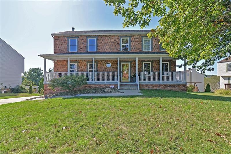 Beautiful colonial home with a great front porch - perfect for the porch swing or rockers.