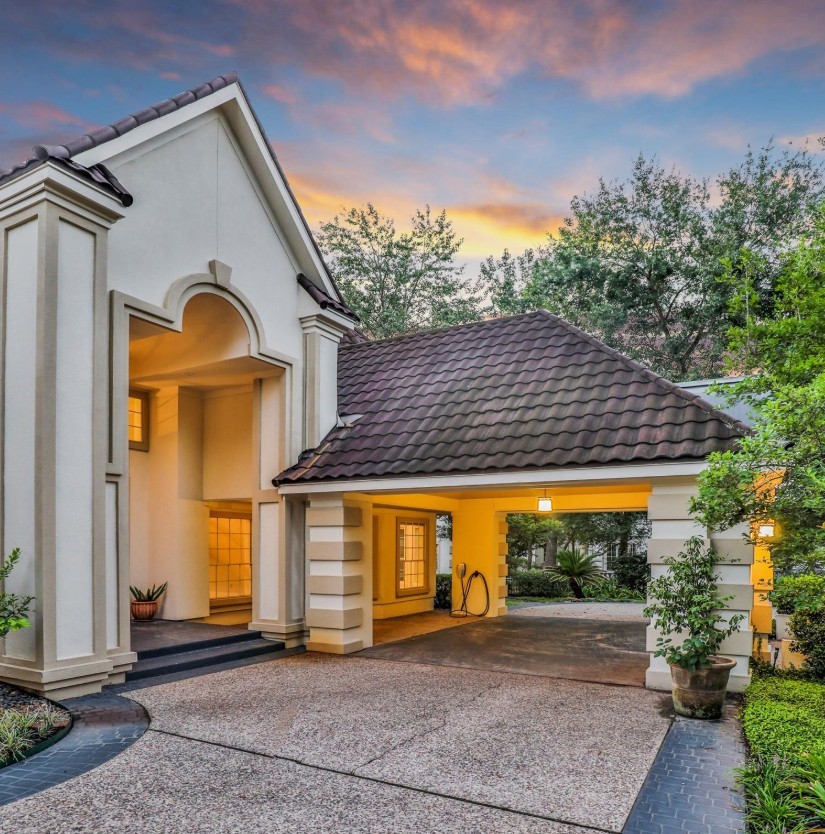 35 West Isle Place The Woodlands, TX 77381 - Photo 12 of 45 Covered front entry with elegant architectural details and spacious three-car garage.