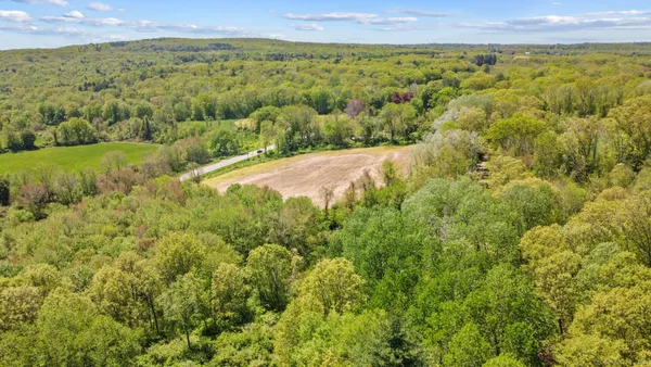 a view of a swimming pool with a yard