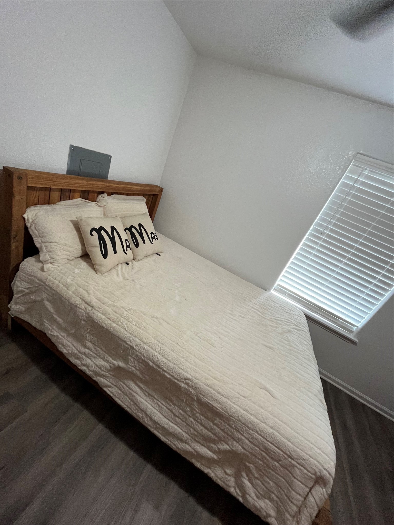 210 South Colbert Street Dayton, TX 77535 - Photo 12 of 14 a bedroom with a bed and a night stand