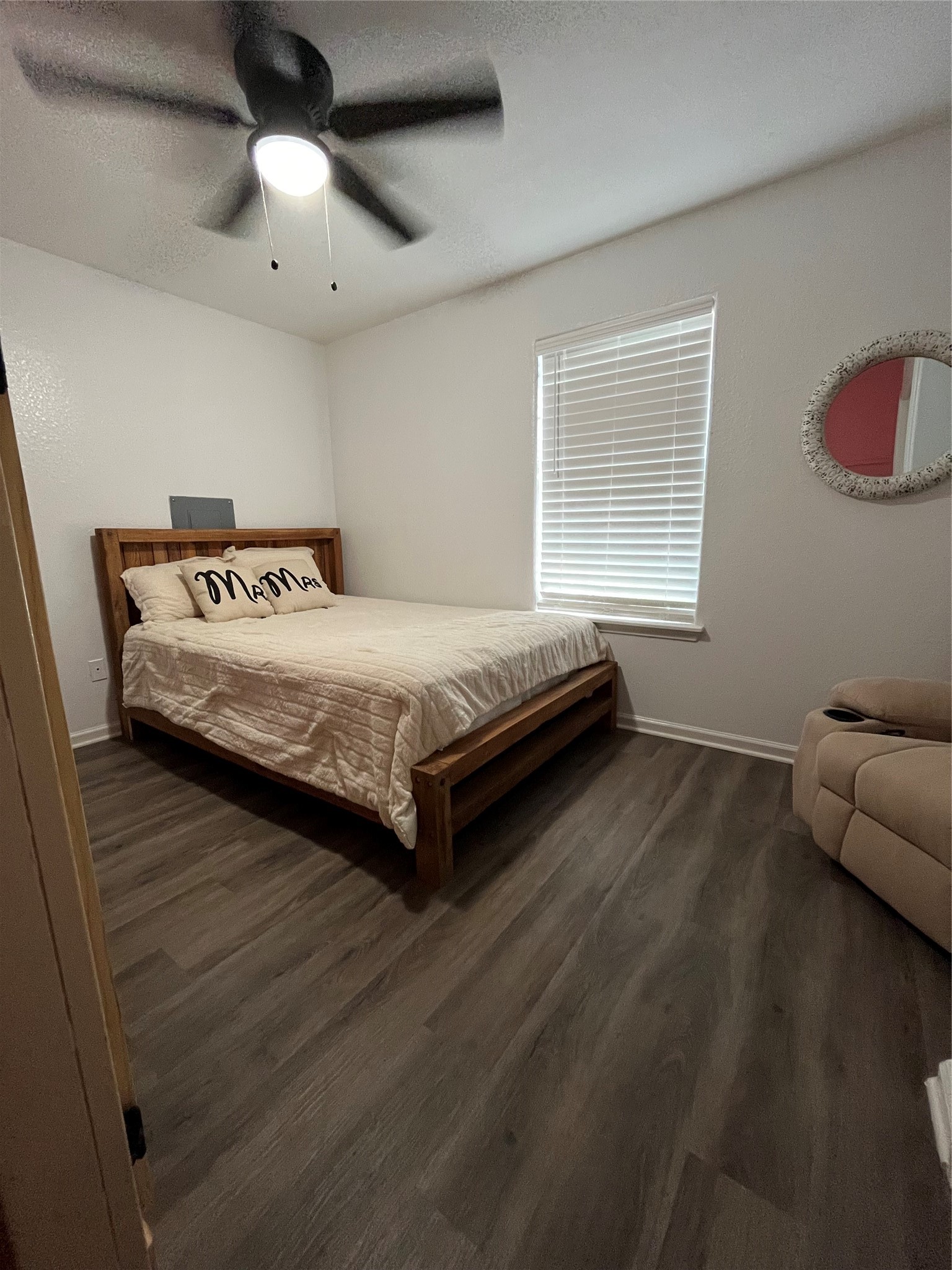 210 South Colbert Street Dayton, TX 77535 - Photo 13 of 14 a spacious bedroom with a bed and window