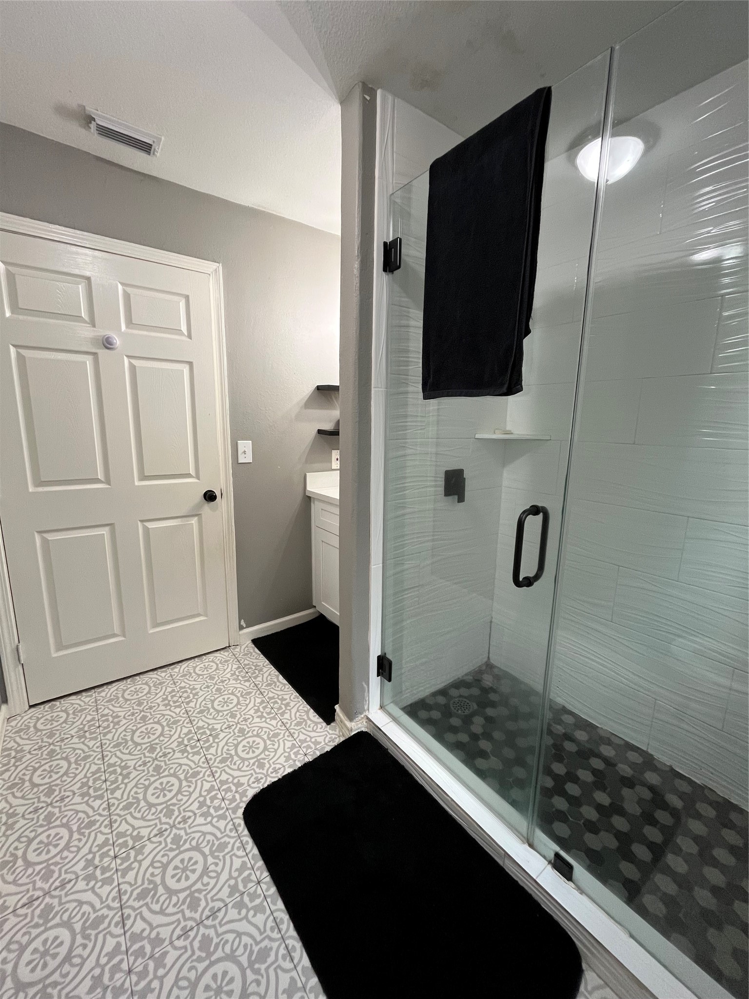 210 South Colbert Street Dayton, TX 77535 - Photo 3 of 14 a bathroom with a sink and a mirror