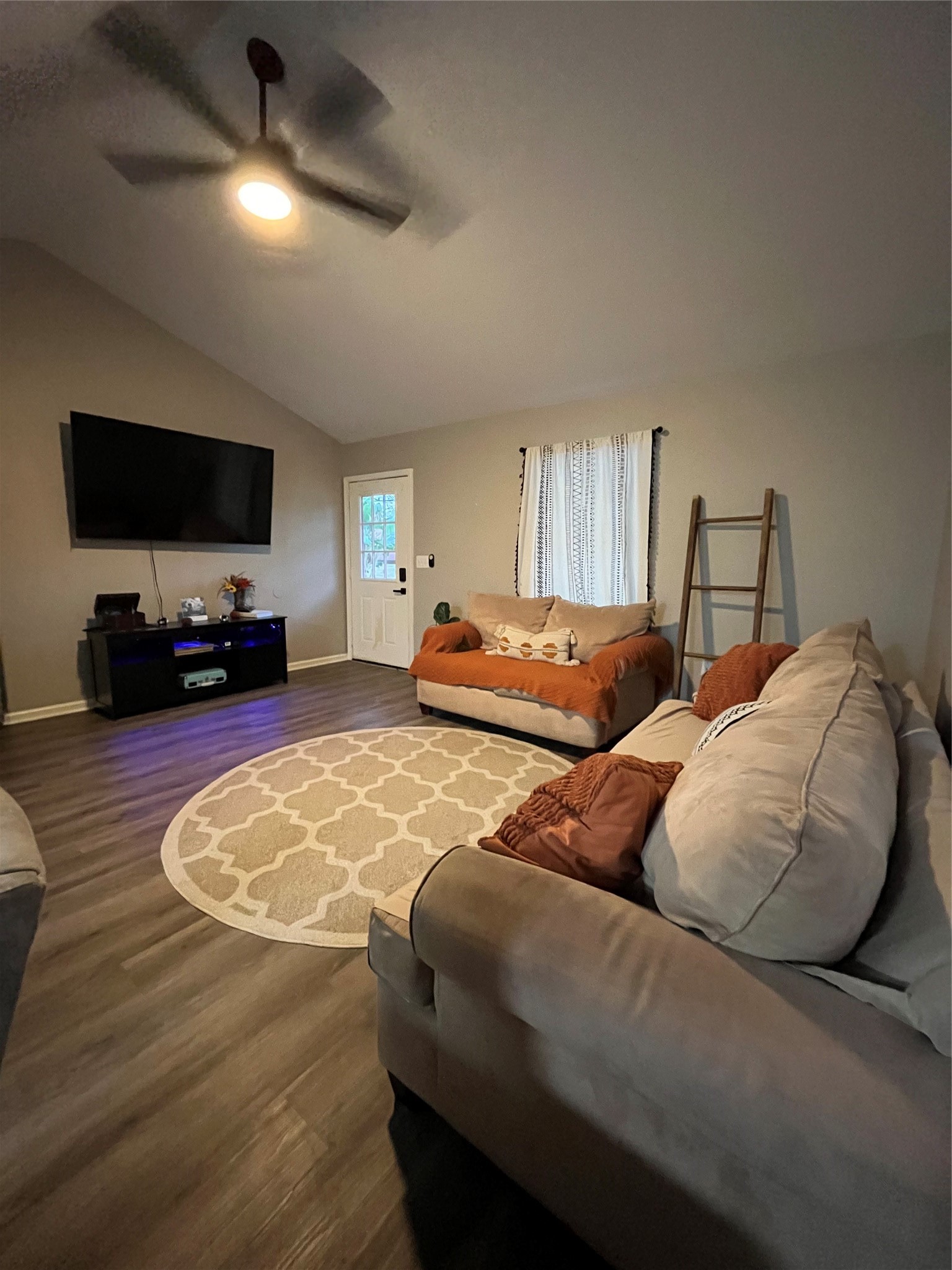 210 South Colbert Street Dayton, TX 77535 - Photo 10 of 14 a bedroom with two beds and a flat screen tv