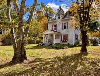 239 Pelham Road Amherst, MA 01002 - Photo 1 of 30 a front view of a house with a yard