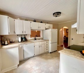 239 Pelham Road Amherst, MA 01002 - Photo 14 of 30 a kitchen with white cabinets and white appliances