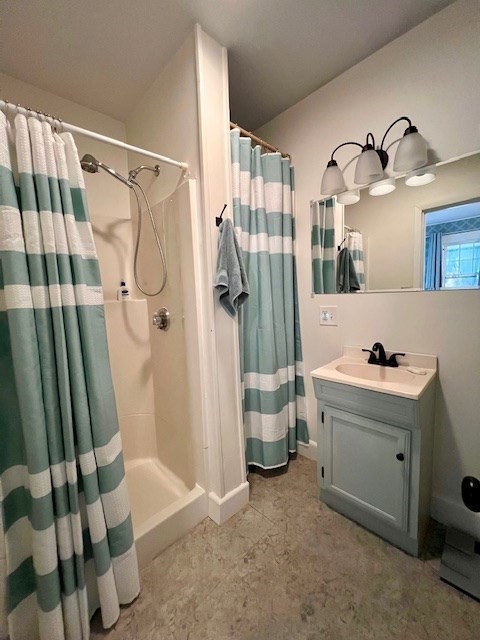 239 Pelham Road Amherst, MA 01002 - Photo 18 of 30 a bathroom with a sink and mirror with bathtub