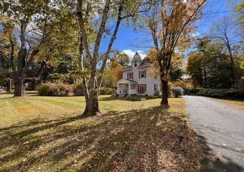 239 Pelham Road Amherst, MA 01002 - Photo 2 of 30 a view of street with trees