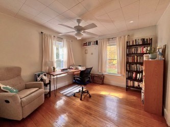 239 Pelham Road Amherst, MA 01002 - Photo 23 of 30 a living room with furniture or window and a wooden floor